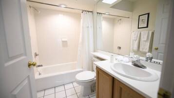 Bathtub, hair dryer, towels, soap