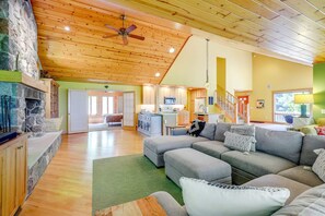 Smart TV, fireplace, books, computer monitors