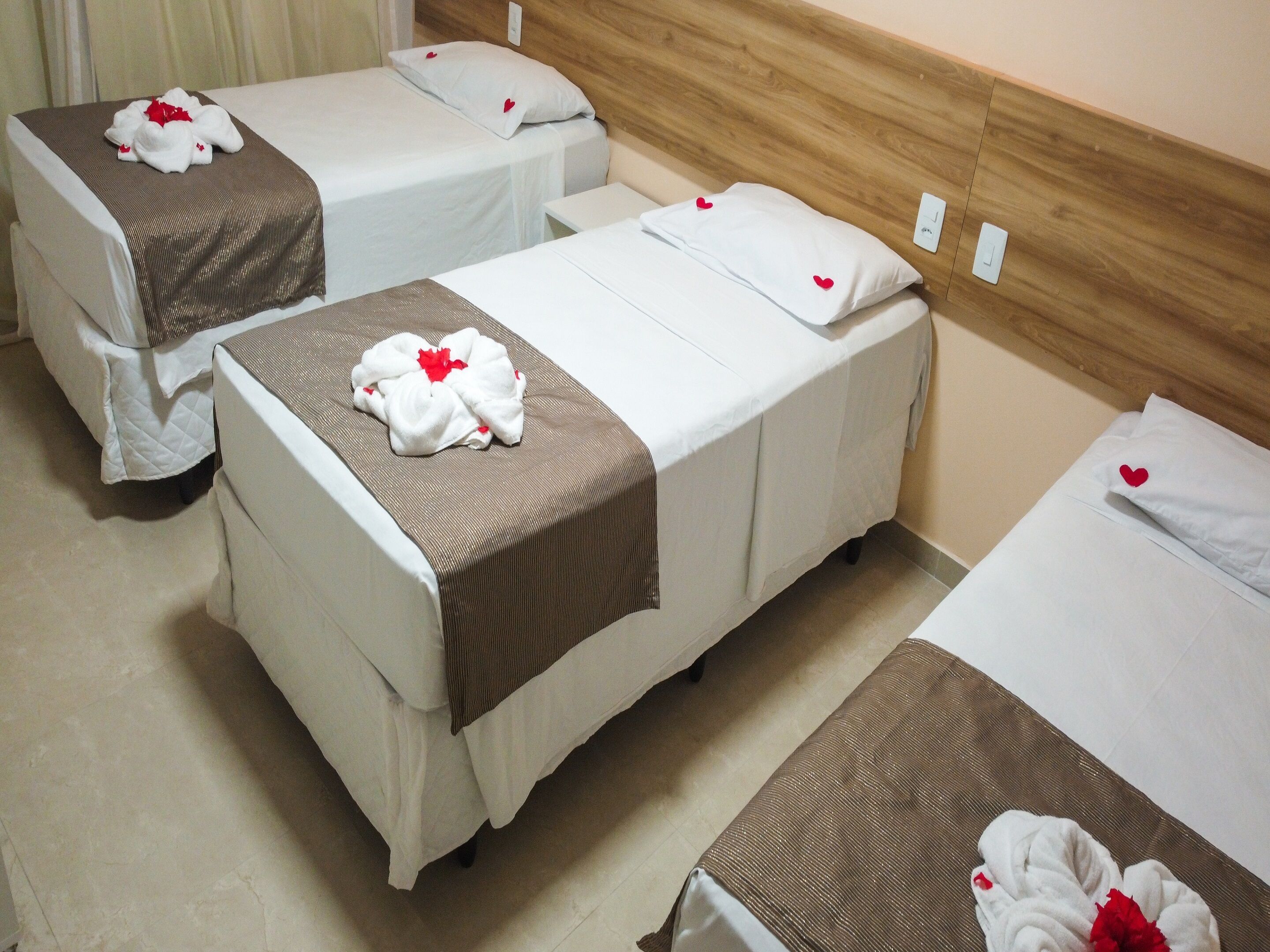 Deluxe Quadruple Room | Desk, blackout drapes, iron/ironing board, free WiFi