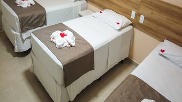 Deluxe Quadruple Room | Desk, blackout drapes, iron/ironing board, free WiFi