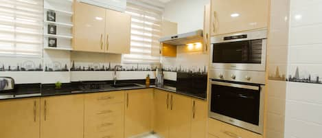 Exclusive Apartment, 2 Bedrooms | Private kitchen | Full-sized fridge, microwave, oven, stovetop