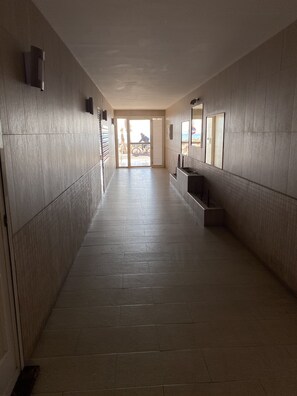 Leading to a spacious room with a large sliding glass door.