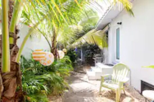Stroll through the serene garden-lined corridor, leading to a tranquil retreat.