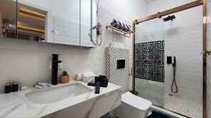Shower, hair dryer, towels, soap