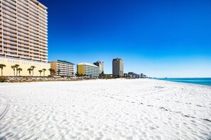On the beach, sun loungers, beach towels