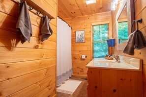 Combined shower/tub, hair dryer, towels, soap