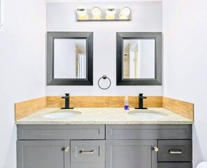 Combined shower/tub, hair dryer, towels, soap