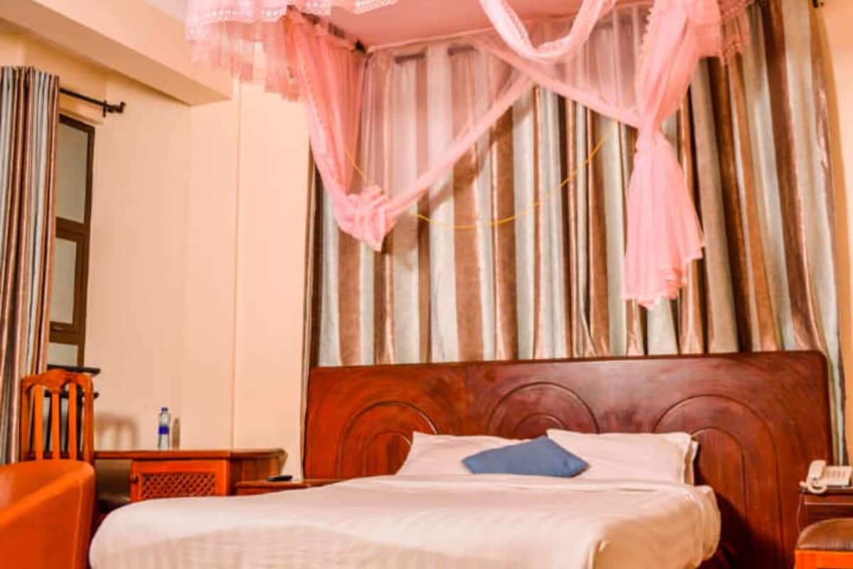 Standard Room | Blackout drapes, iron/ironing board, WiFi (free), bed sheets