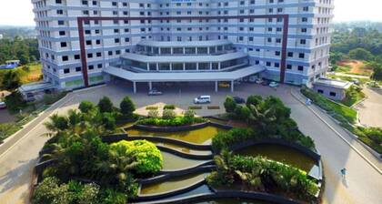 Cozy 1BR Near Rajagiri Hospital WiFi,AC, FREE Breakfast