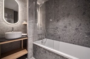 Bathtub, hair dryer, towels