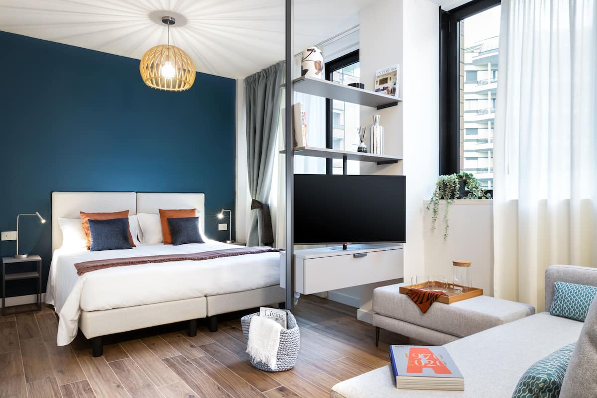Premium bedding, down duvets, laptop workspace, blackout curtains