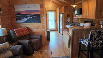 Cabin 2, Deluxe King Bedroom, Hot Tub | Living area | 43-inch Smart TV with digital channels