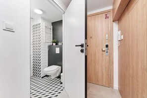 Shower, hair dryer, towels, shampoo - Stylish Studio with Mezzanine | Air Conditioning, Close to Airport (Wroclaw)