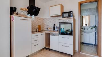 Apartment (Superior One Bedroom Apartment with T) | Private kitchen | Fridge