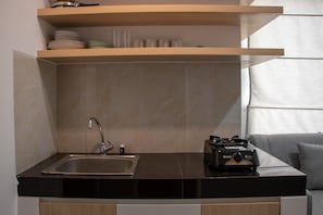Fridge, stovetop, electric kettle, cookware/dishes/utensils