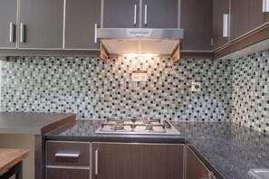 Fridge, stovetop, cookware/dishes/utensils, dining tables - Minimalist And Comfort 2Br At City Home Moi Apartment (Jakarta)