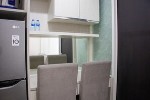 TV - Minimalist 1Br Apartment With Pool View At Atlanta Residences (Depok)