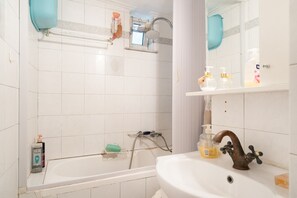 Bathtub, hair dryer, towels