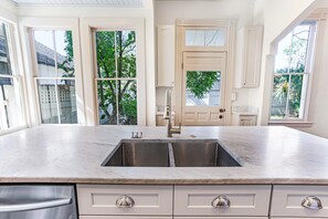 Fridge, microwave, oven, stovetop - Impeccably Restored Bungalow w/ Private Yard and Parking by Lucky Savannah (Savannah)