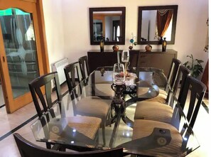 Enjoy meals in this stylish dining area with a round table and six comfortable chairs.