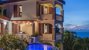 A multi-story house with a swimming pool, outdoor seating, and a view of the sea. - Private Villa*MagensBay *Ocean front* Private Pool (St. Thomas)
