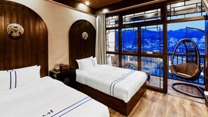 A hotel room with two beds, a large window with a view, a wooden ceiling, and a hanging chair by the window. - Wangjiang Shanju Guesthouse (Fenghuang County)