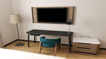 A modern room with a desk, chair, lamp, and a small bedside table.