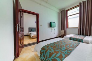 A hotel room with two beds, a large mirror, a television, and a window with curtains. - Huashan - Loft Youth Mountain Residence (Huayin)