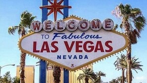 A neon sign with the text "WELCOME TO Fabulous LAS VEGAS NEVADA".