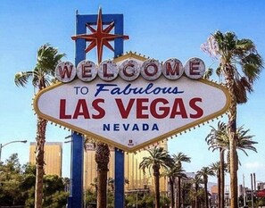 A neon sign with the text "WELCOME TO Fabulous LAS VEGAS NEVADA".