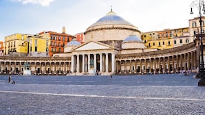 A historic square with a prominent church featuring a large dome and classical architecture. - HUB NAPLES (Naples)