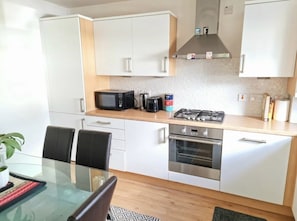 Family House | Private kitchen | High chair - Boutique 3-bed Home with Free Parking in Glasgow (Glasgow)