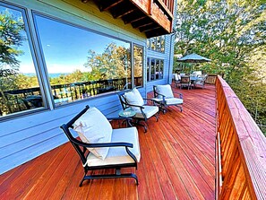 Relax on the deck with comfortable seating and take in the expansive views of the surrounding landscape.