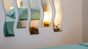 A bedroom with a bed, a nightstand, and a lamp. - Rina Apartments - Superior One Bedroom Apartment with Terrace and Sea View (Baric Draga)