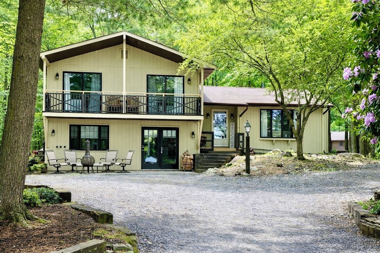 4 BR, 2 1/2 bath with 2 living spaces, balcony, deck, firepit, and much more