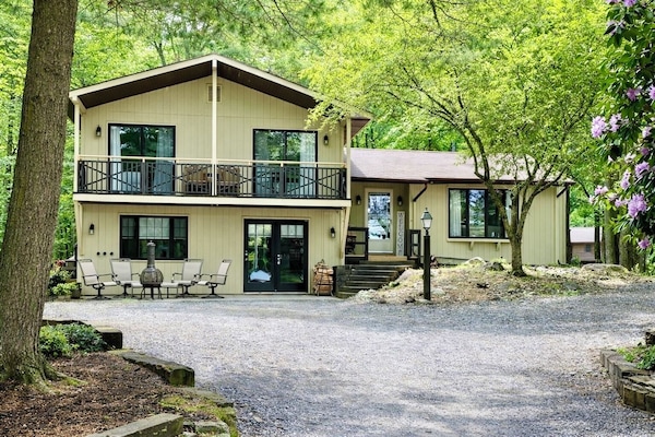 4 BR, 2 1/2 bath with 2 living spaces, balcony, deck, firepit, and much more