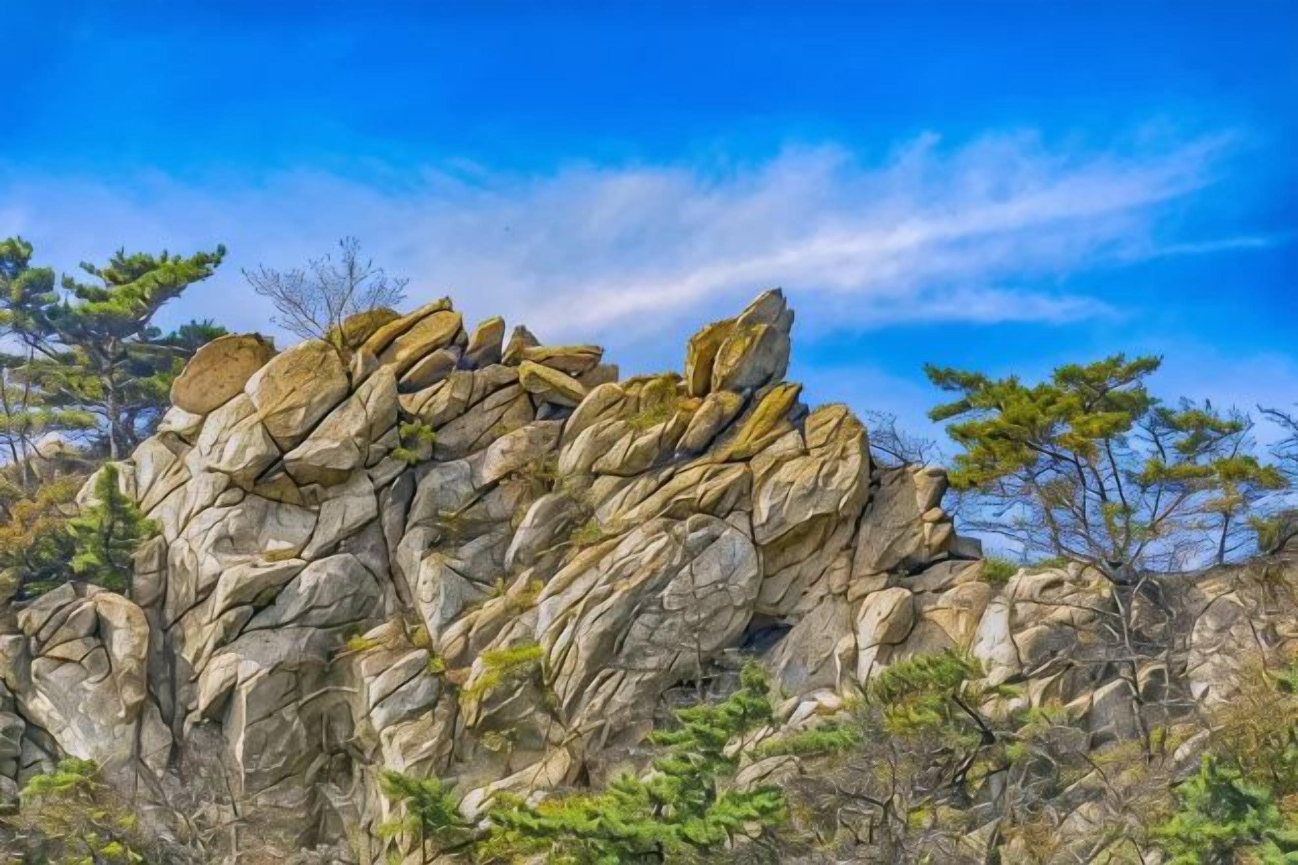 A rocky outcrop with a clear sky.