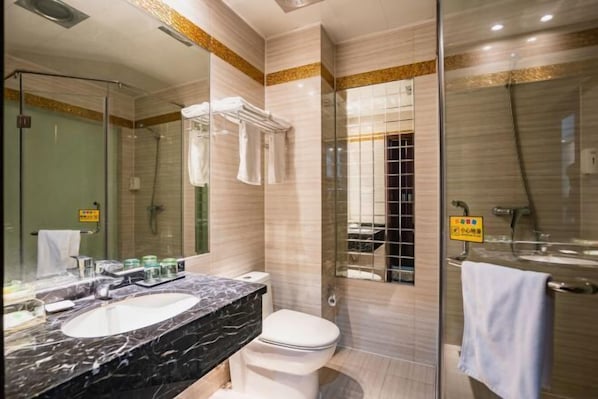 A modern bathroom with a dual sink vanity, a toilet, a glass-enclosed shower, and a large mirror. - Borrman (hangzhou xianghu) (Hangzhou)