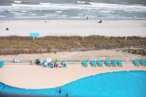 On the beach, sun loungers, beach towels, beach bar