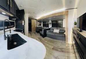 Smart TV, fireplace, books, stereo