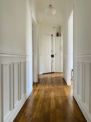 Corridors lead to a door at the end.