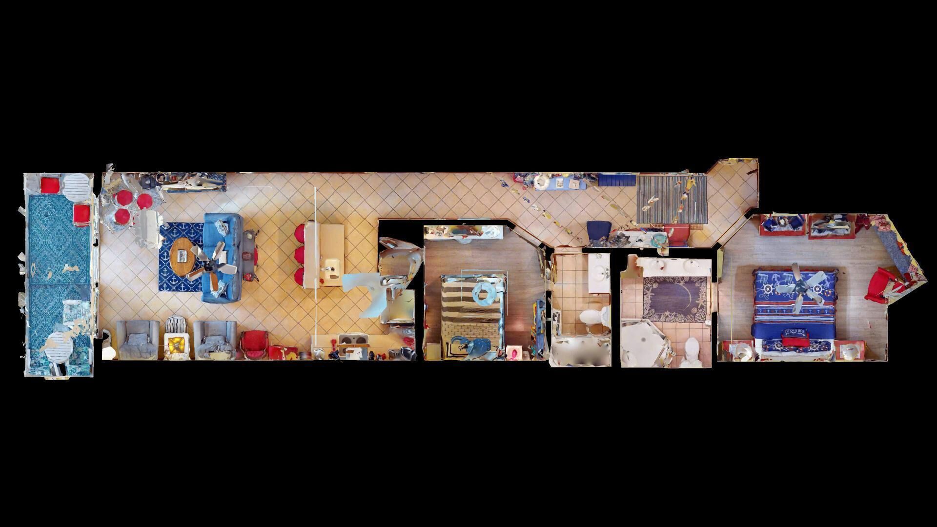 A top-down view of a hotel room layout with a bed, seating area, and a small kitchenette.