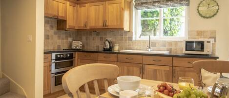 Fridge, microwave, dishwasher, dining tables