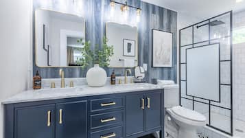 Combined shower/tub, hair dryer, towels, soap