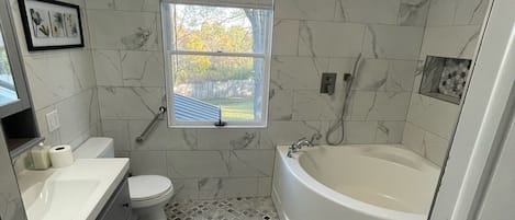 Bathtub, hair dryer, bidet, towels