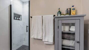 Bathtub, hair dryer, towels