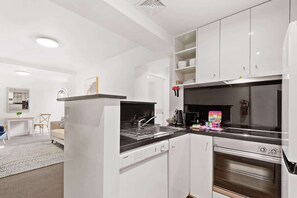 Fridge, microwave, oven, stovetop - Chic 1-Bed Apartment Steps From Shopping Street (South Yarra)