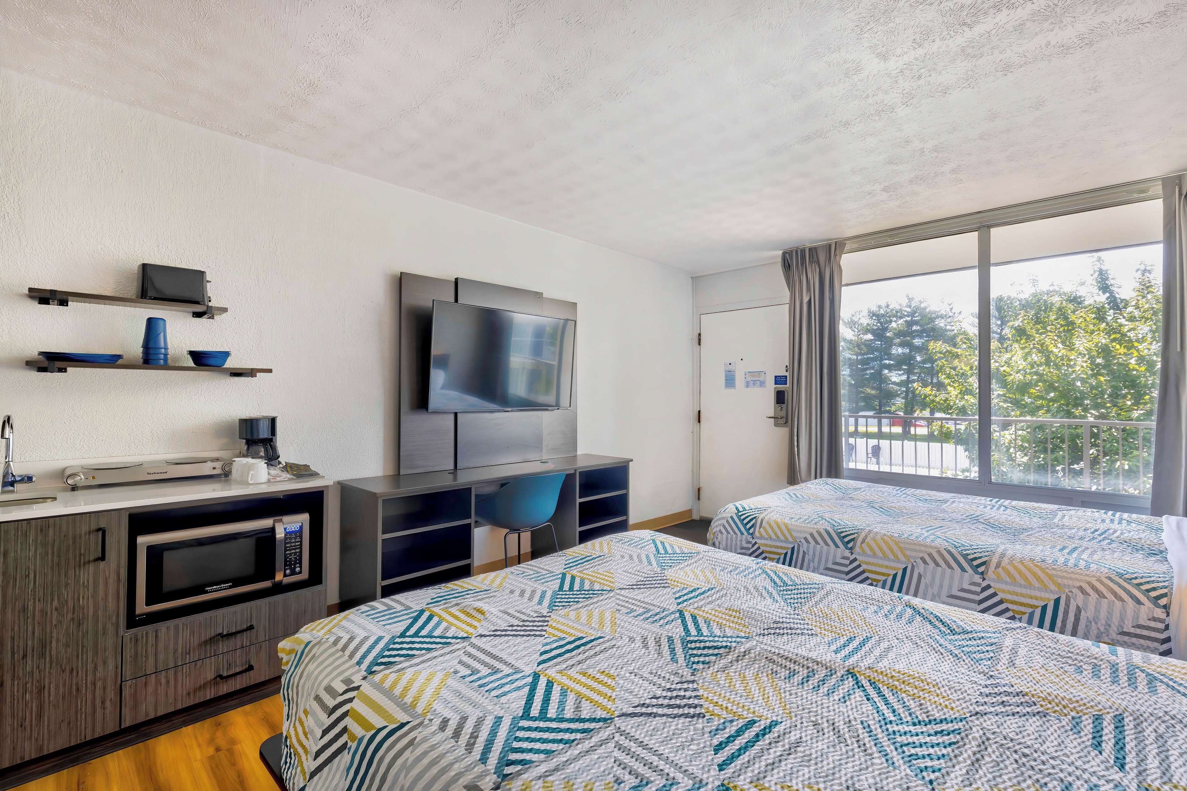 Desk, laptop workspace, blackout curtains, free WiFi