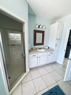Bathtub, hair dryer, towels, soap