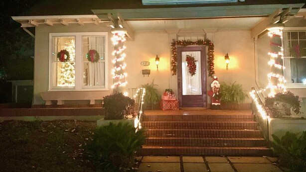 A two-story house with a front porch, decorated with lights and wreaths. - Historical Natchitoches Home, close to downtown and Cane River. (Natchitoches)